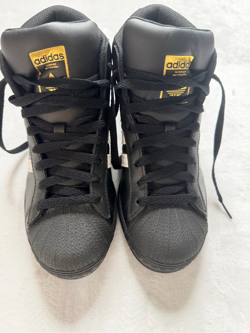 adidas Black High-Top Sneakers with Gold Logo Accents